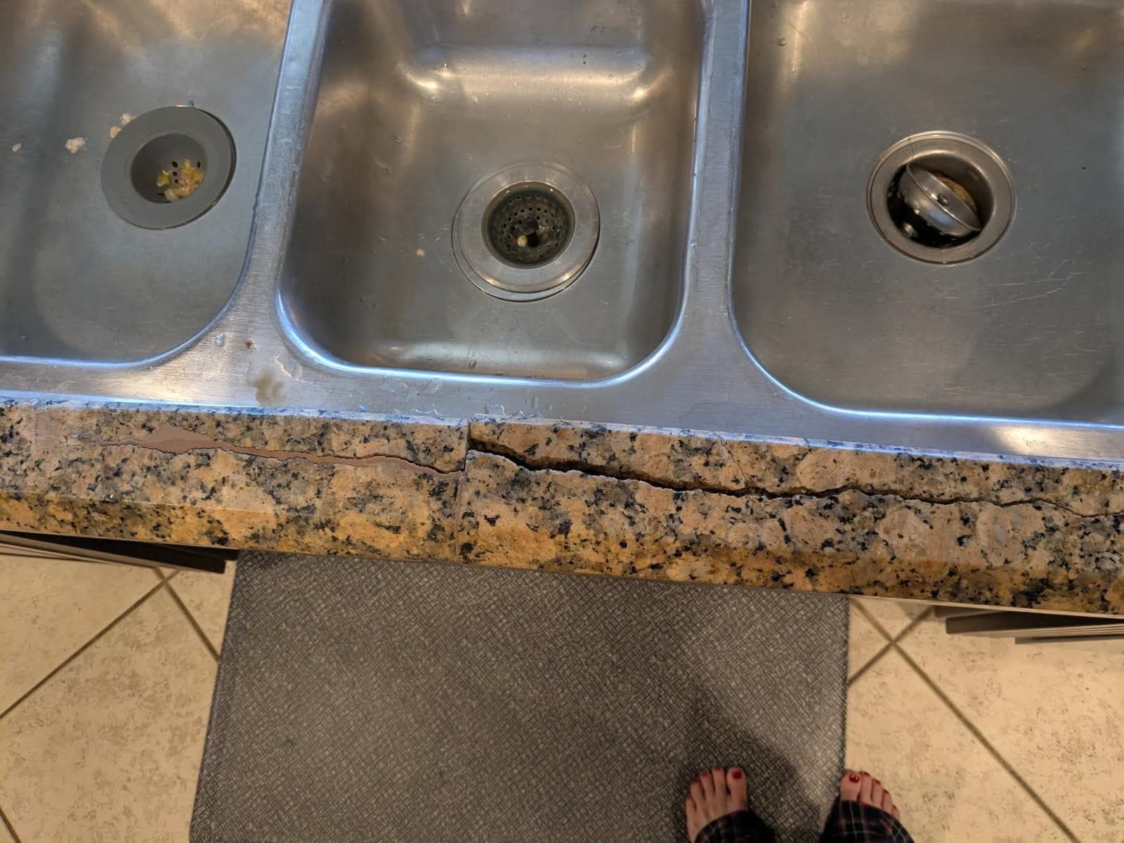 This is one angle of the busted granite. When using the sink, pieces would move around. 