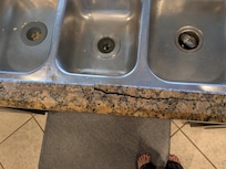 This is one angle of the busted granite. When using the sink, pieces would move around.