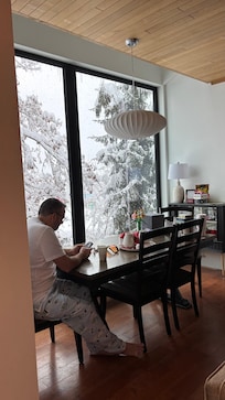 Enjoying coffee at the table while it snows.