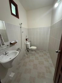 Bathroom is standard SE Asian water room.