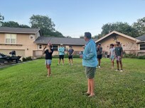 Coaching on casting skills for our group of youth anglers.