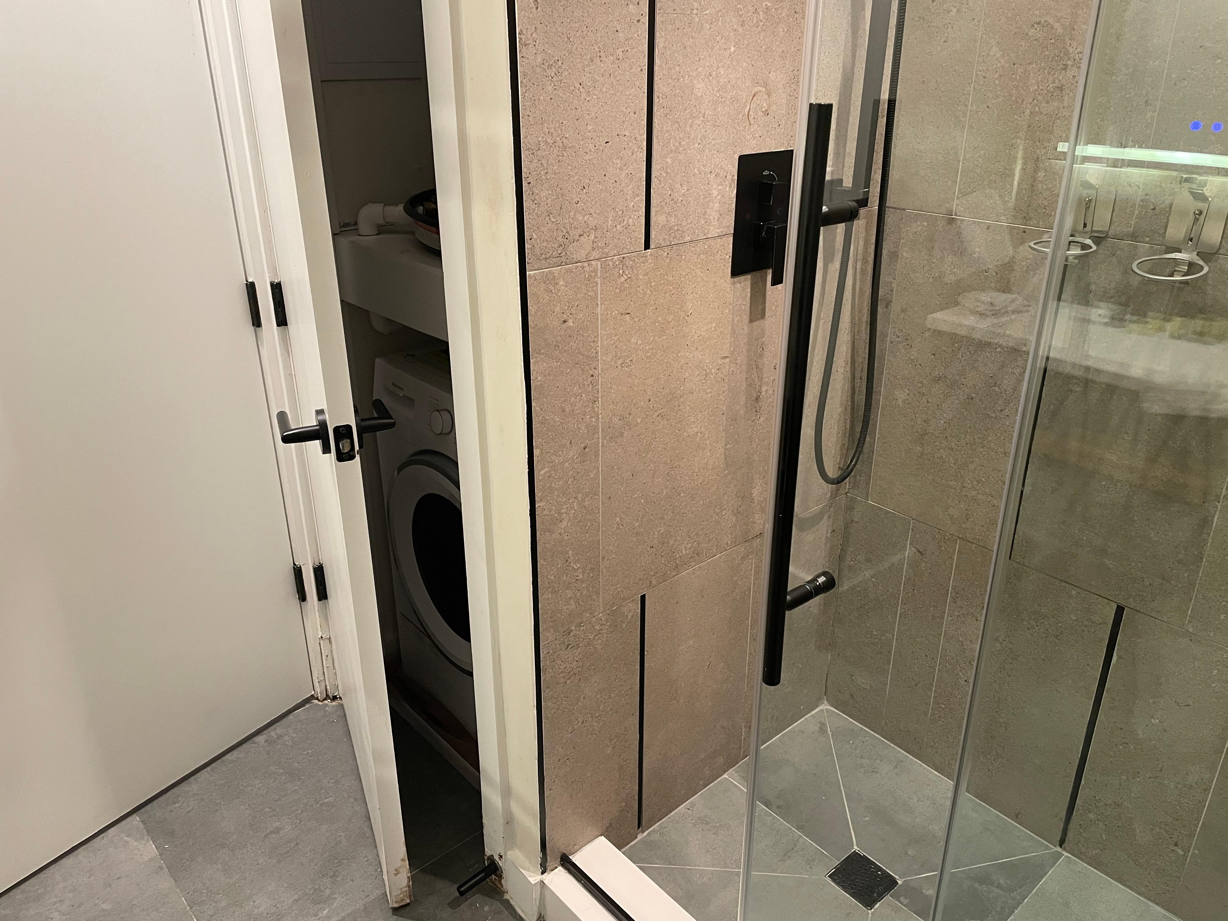 Shower & Washer/dryer in Bathroom