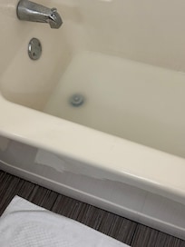 Bathtub filled with water after showering.