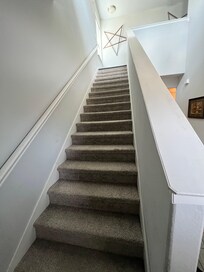 Stairs to upper level where bedrooms are located