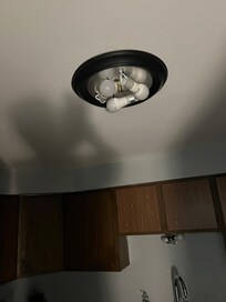 Exposed light fixture in kitchen