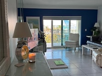 Main room with bed & living room.