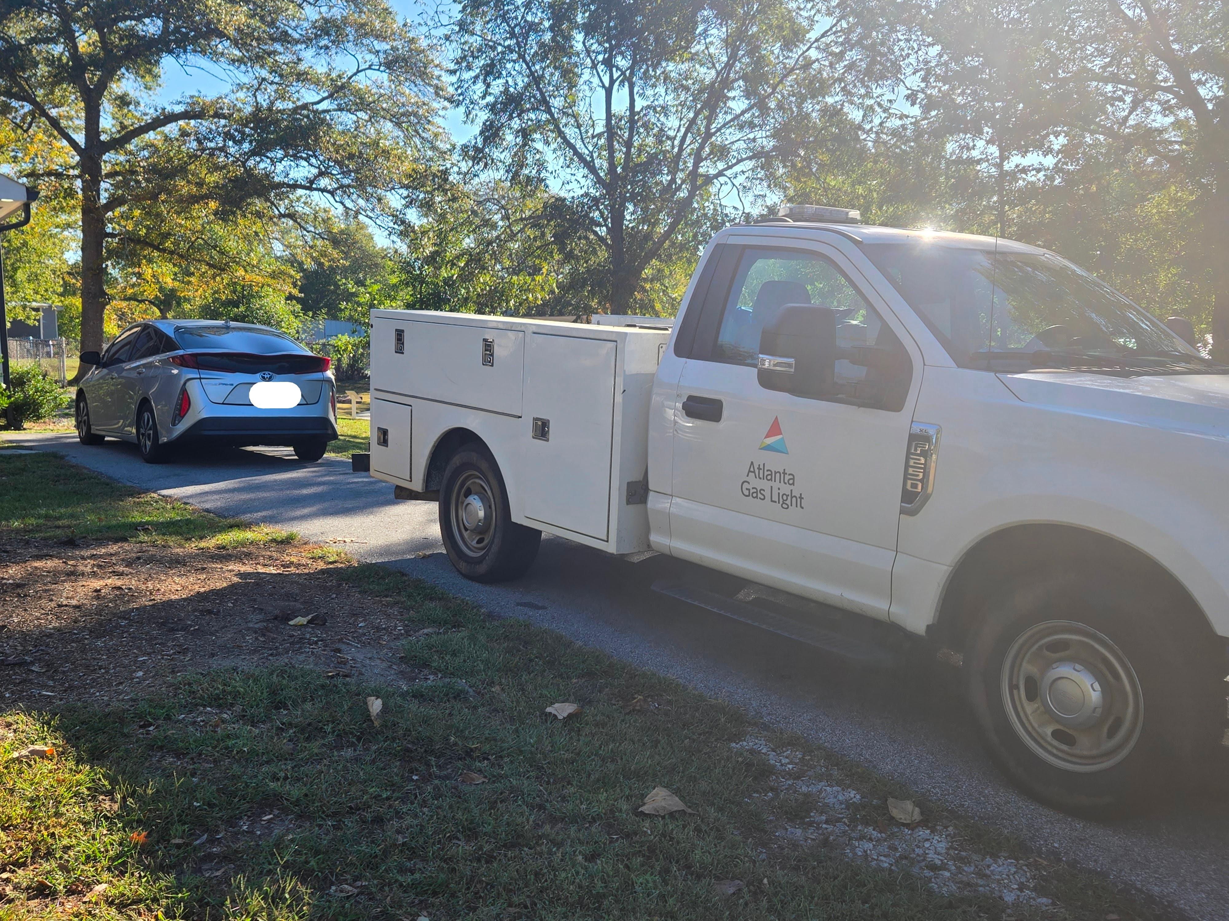 My car blocked in by the gas truck. 