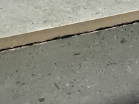 Mold at base of shower.