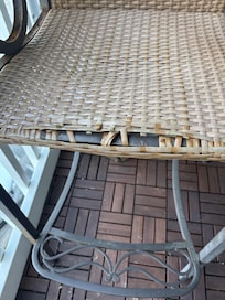 tattered chairs that cut into my legs, so I put a towel down, but still