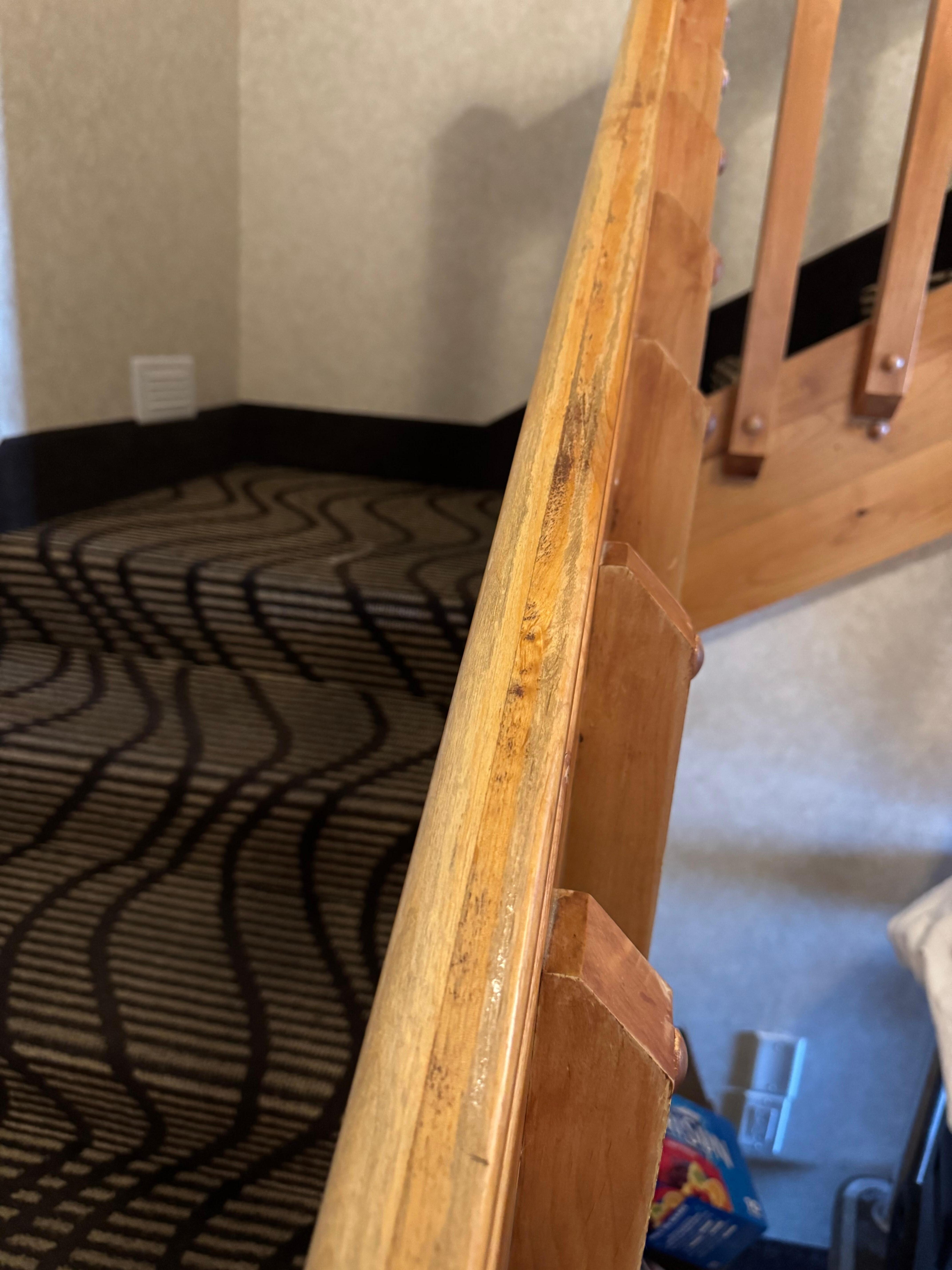 Rough wood on the stair rail