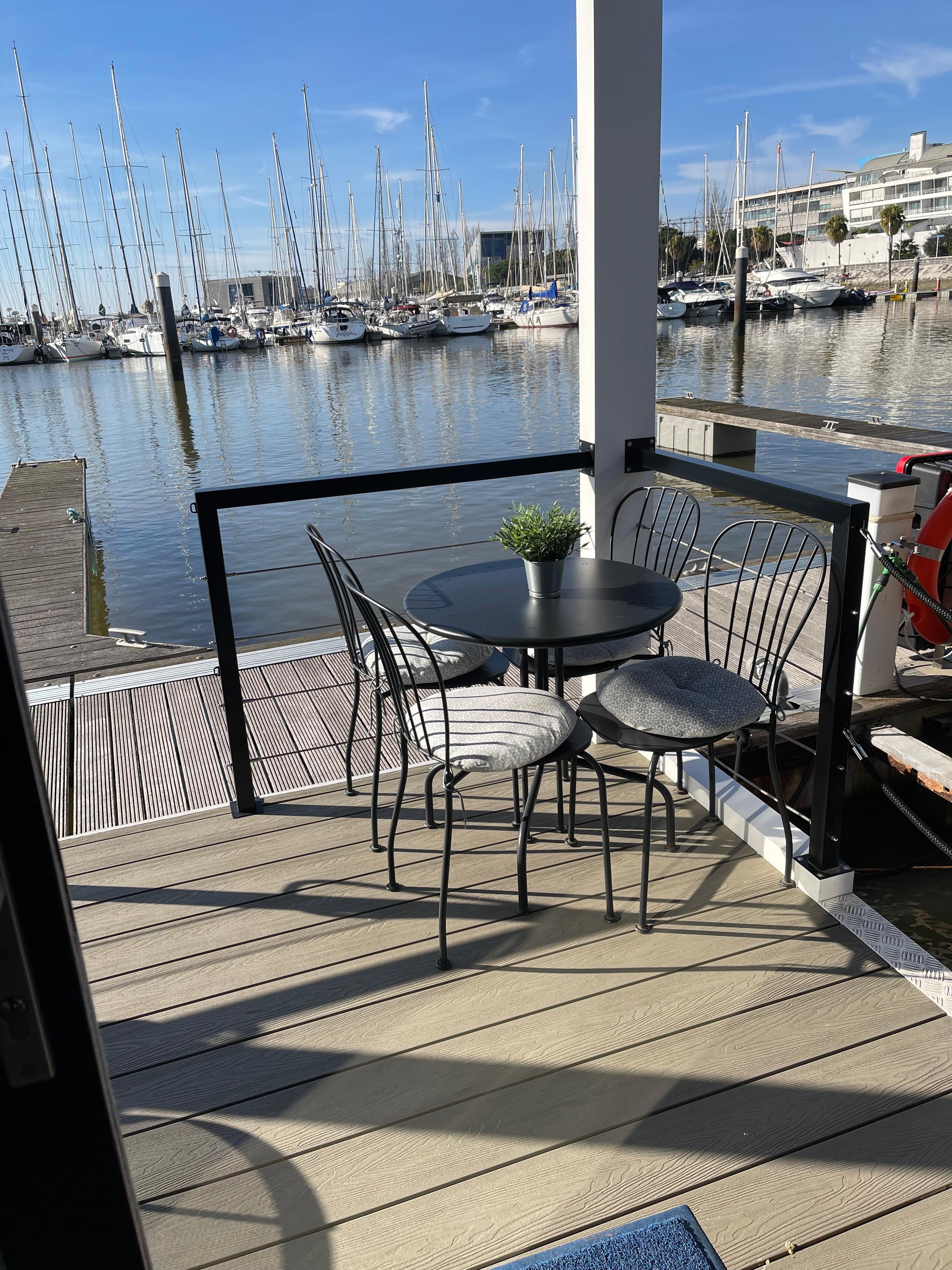 Front patio of houseboat with breakfast table!