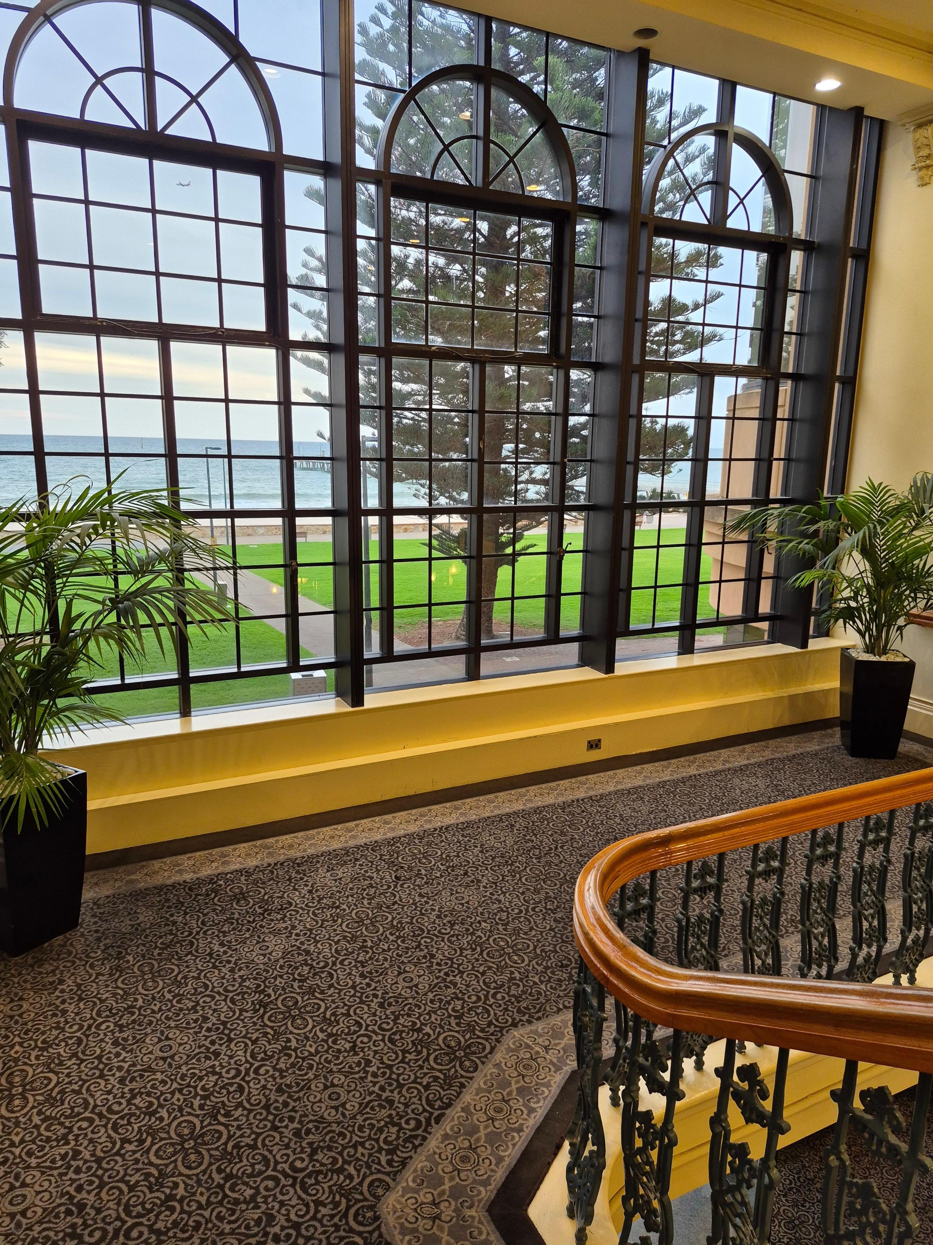 From the stairs, walking towards the Foyer.