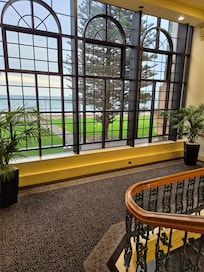 From the stairs, walking towards the Foyer.