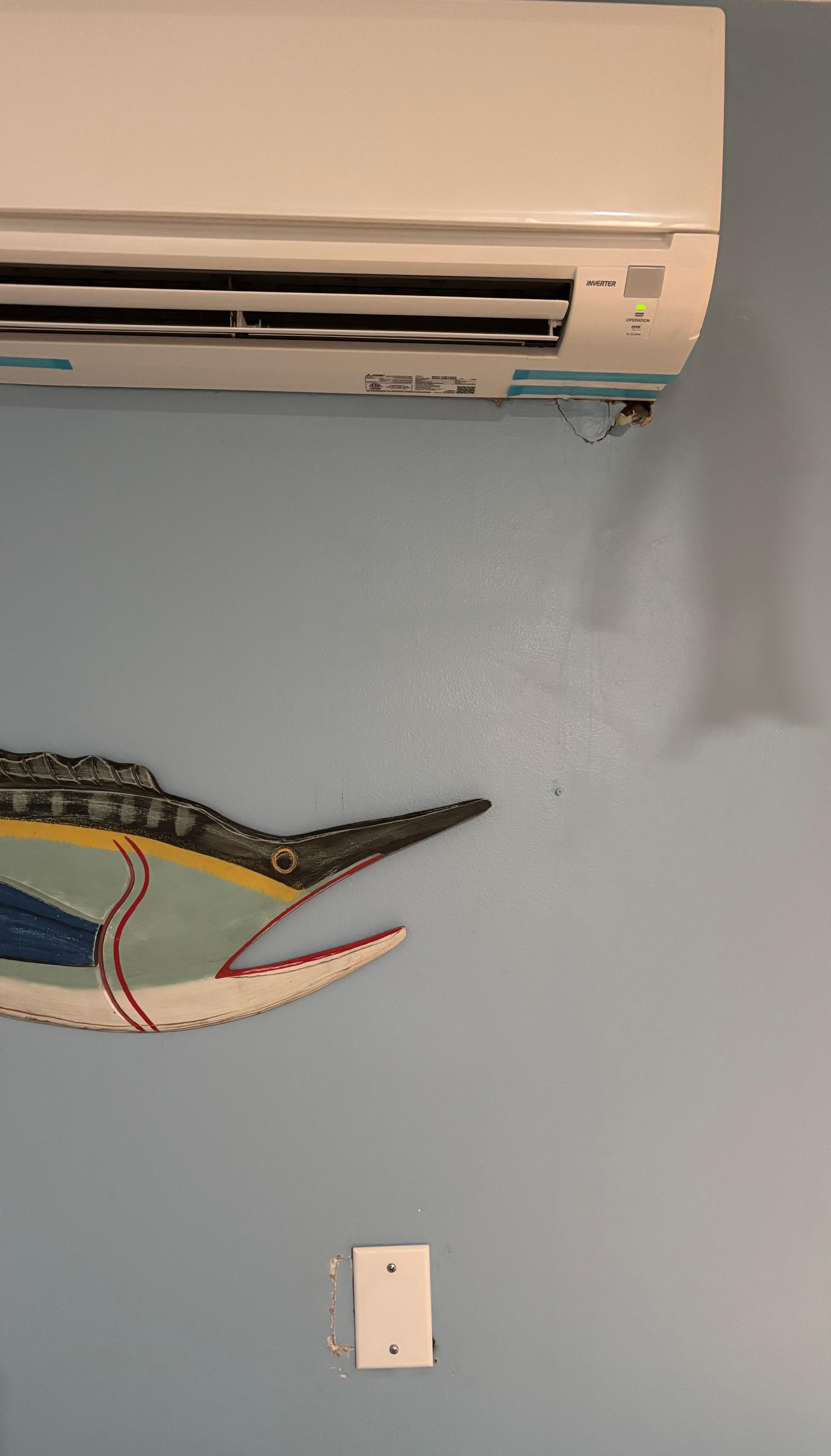 Holes in bunk room wall. 