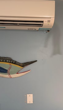 Holes in bunk room wall.