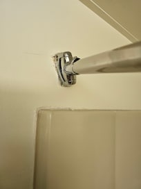 Curtain rod with holes