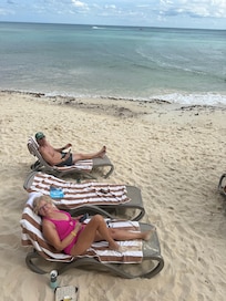 Looking down from the balcony at 101Reef at some family members on the beach.