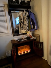 She has heated floors on this winter night to keep me warm besides the heavy duty bed covers, but also this heated stove fireplace made the room warm & toasty
