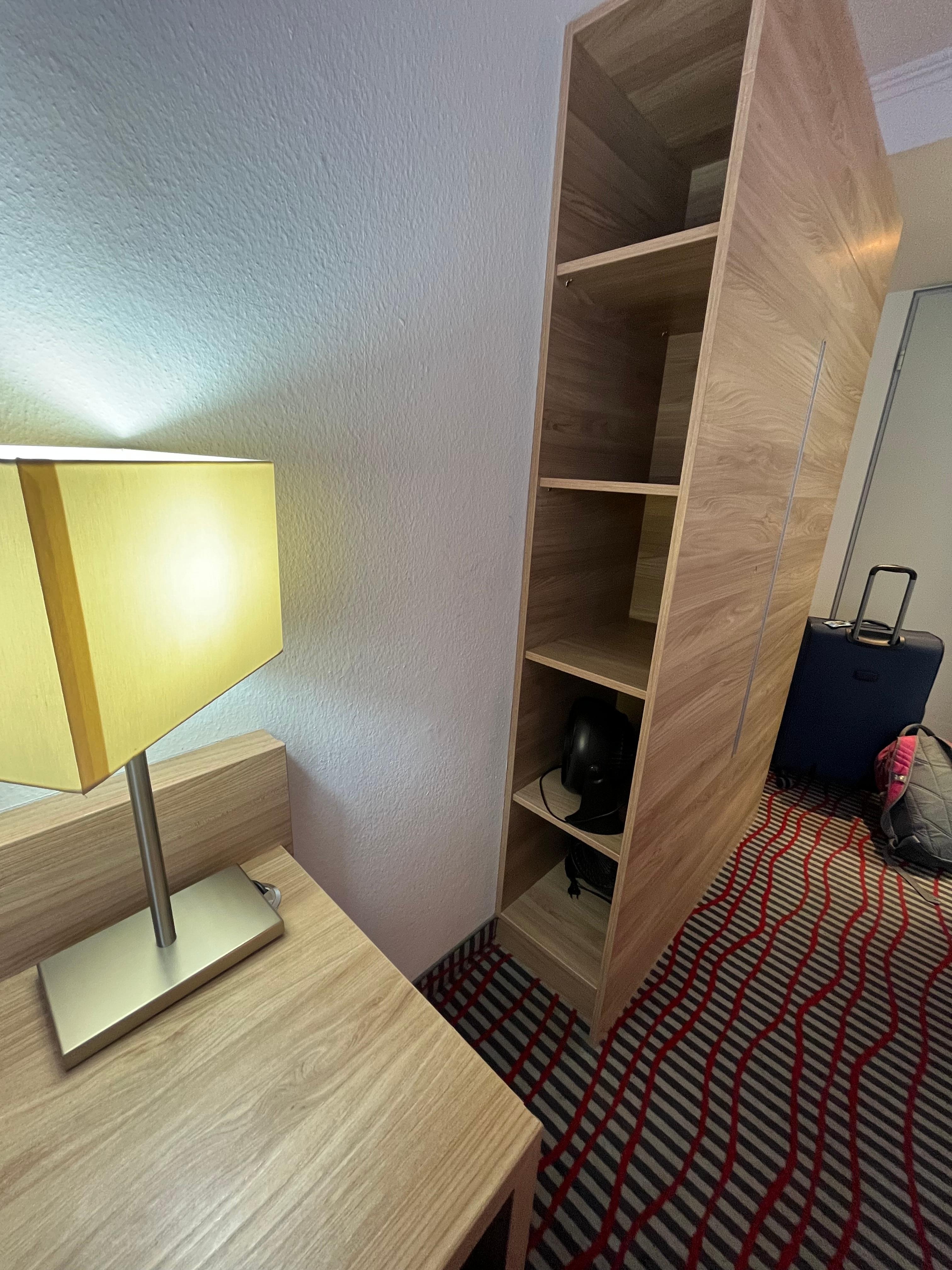 Good storage area with a closet rod on the other side