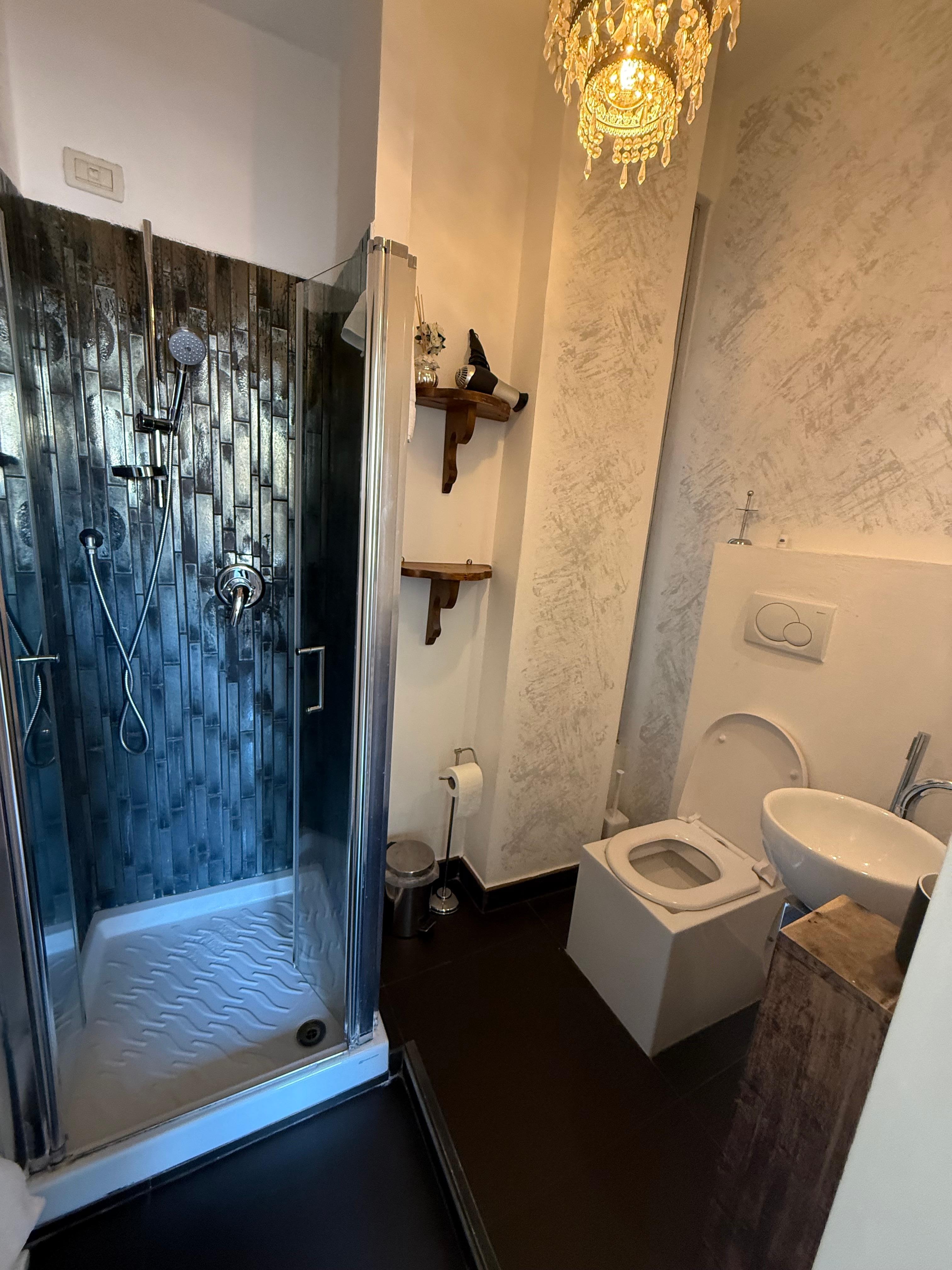 The sink and toilet are almost touching very ,very small