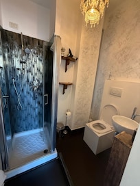 The sink and toilet are almost touching very ,very small