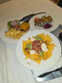 Cheeseburger and fries, sushi and loaded nachos