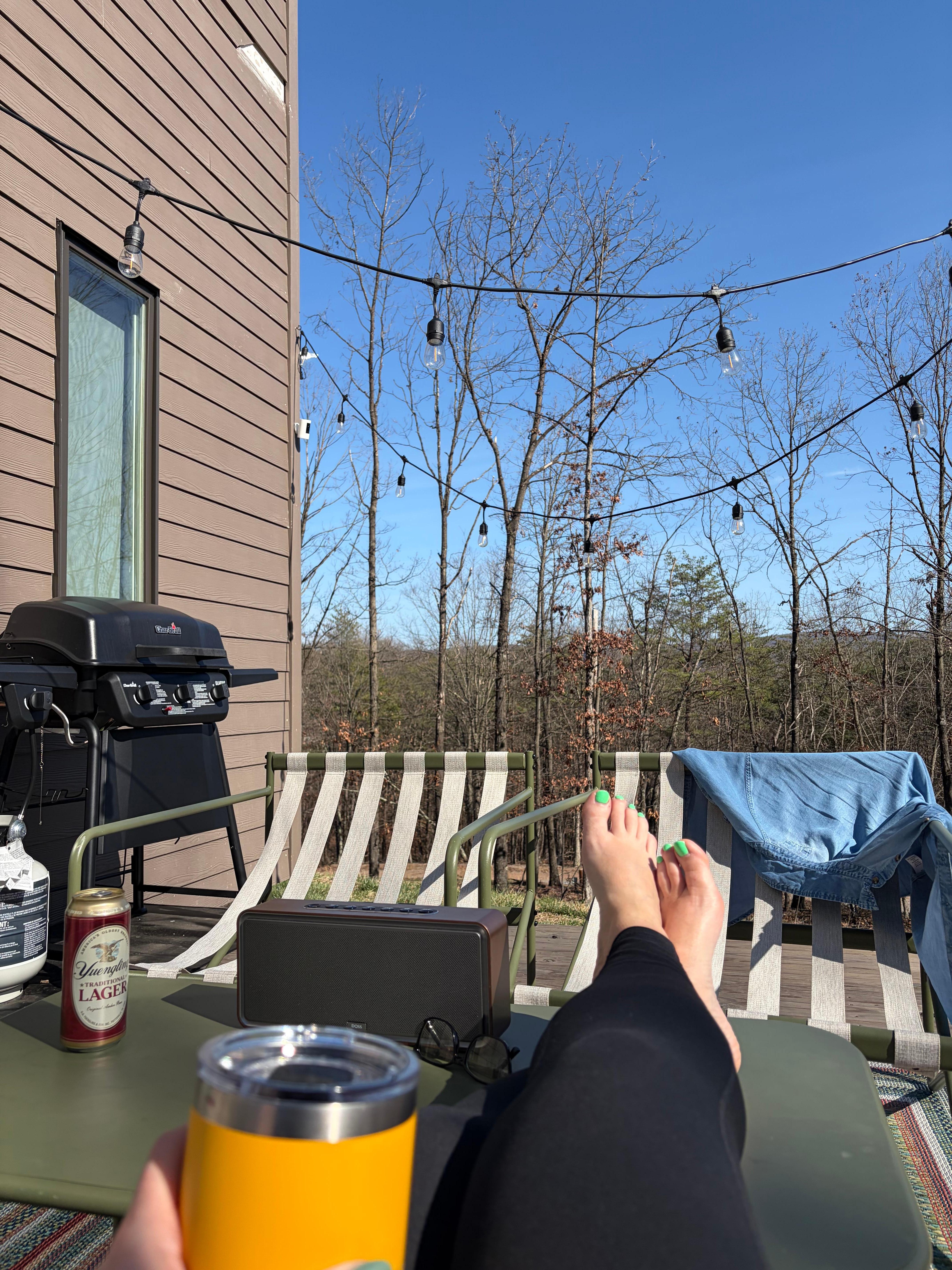 The back deck, yeti, and furniture provided a nice place to relax and unwind in nature. 