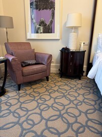 Room side ok but some furniture needs updating. Sofa and chairs look cheap.