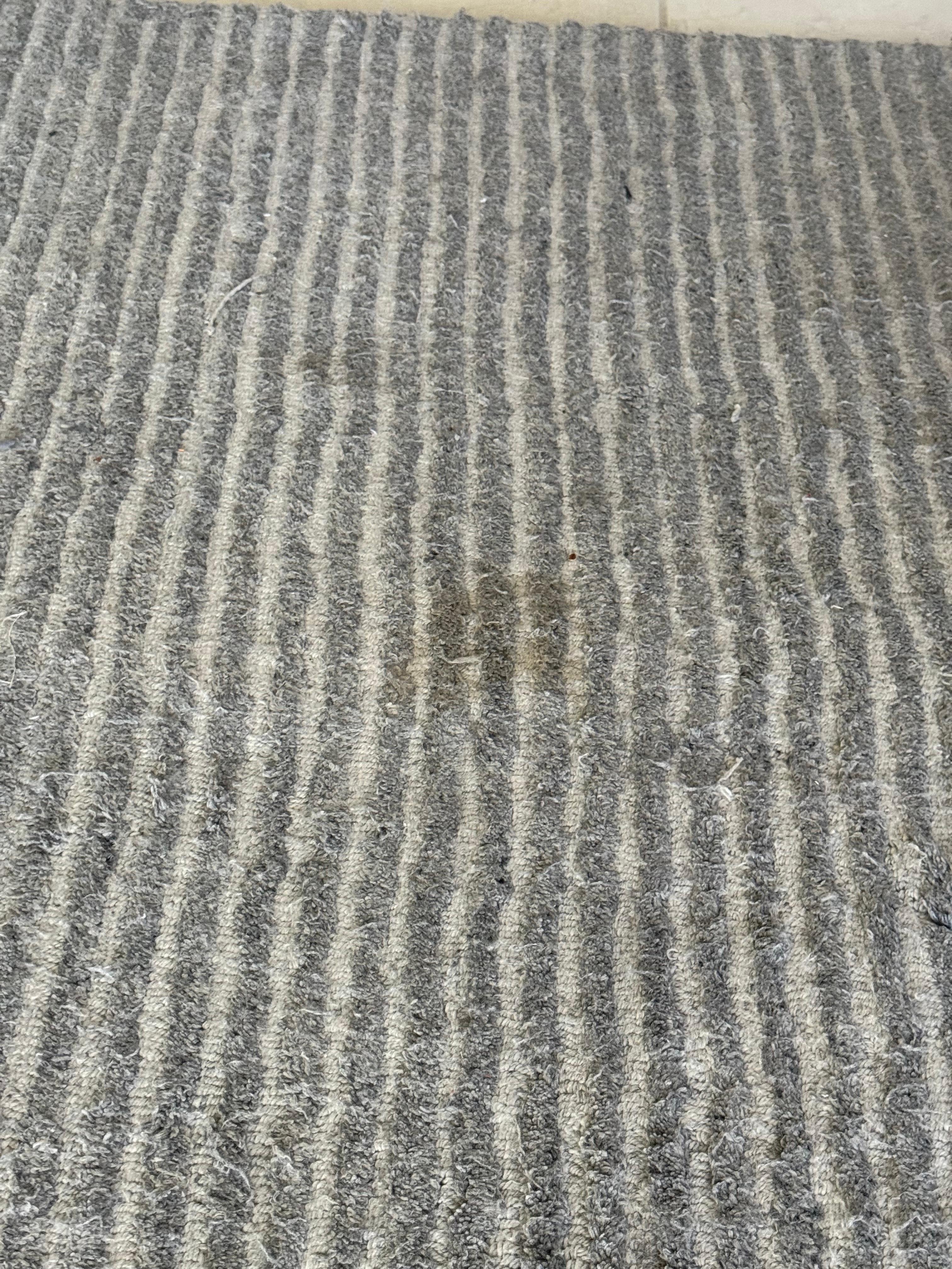 Stained and worn out rugs.