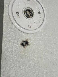 Burn mark below smoke detector, that u found battery less in a drawer