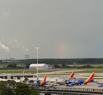 Planes at their terminal and a rainbow! View from the rooms balcony.