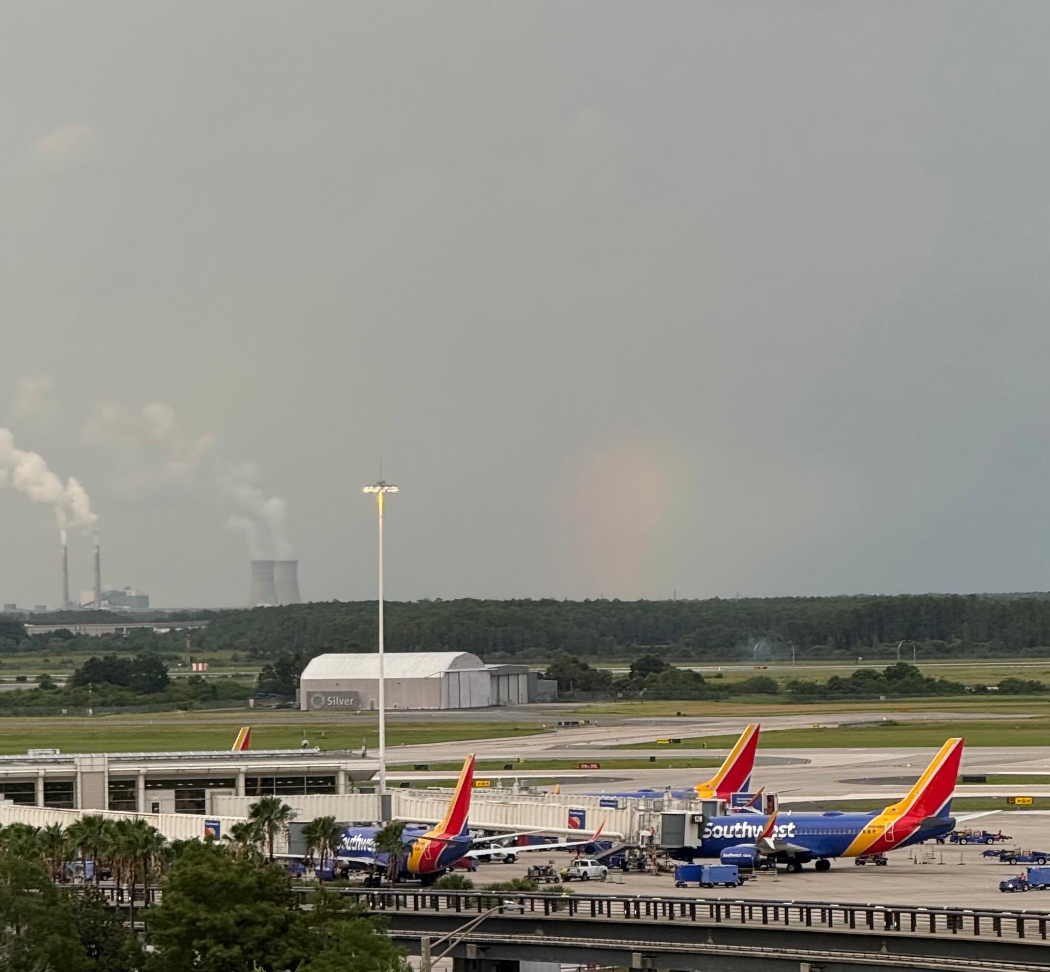 Planes at their terminal and a rainbow! View from the rooms balcony. 