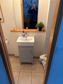Bathroom off of the kitchen and living room