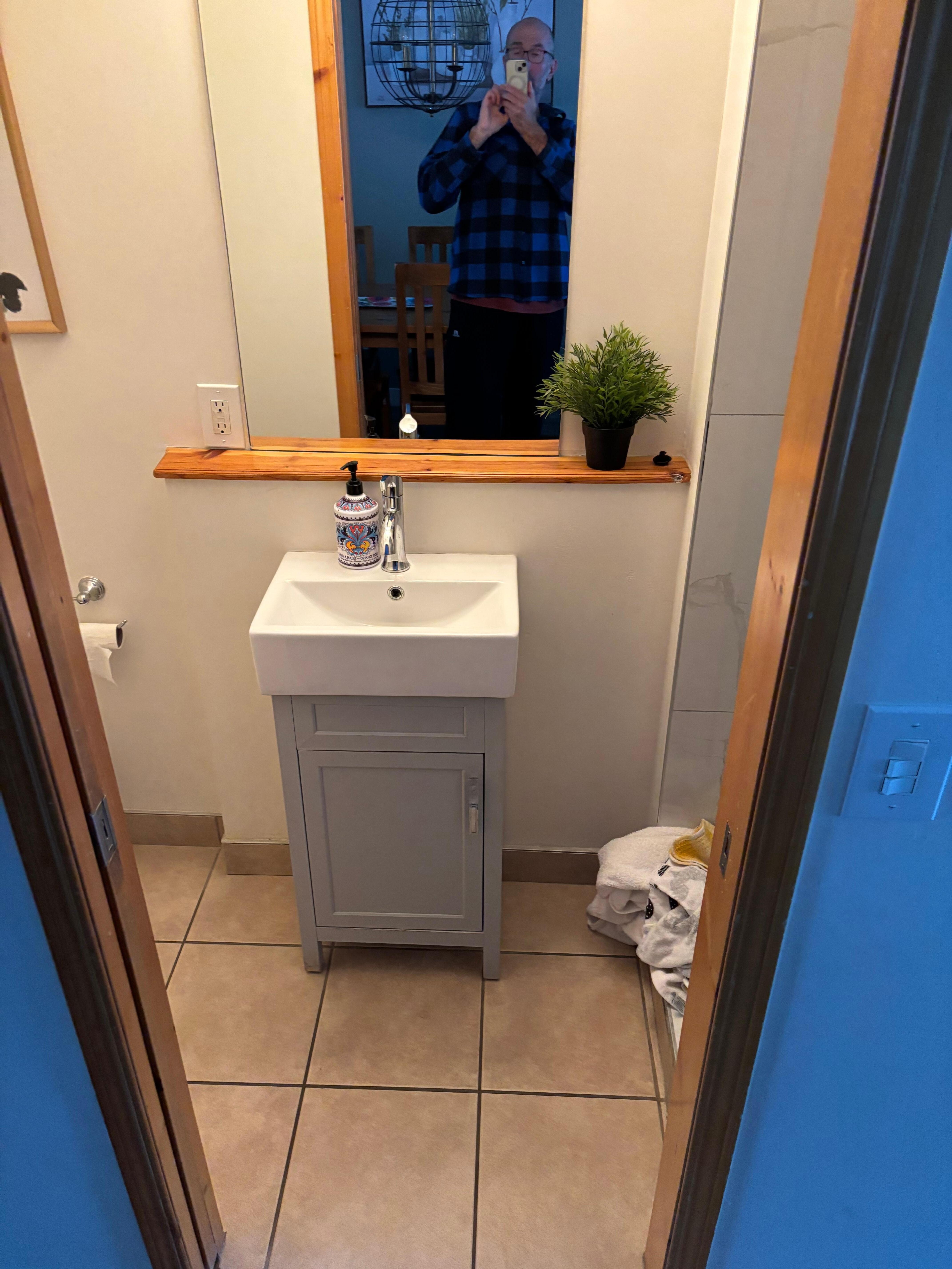 Bathroom off of the kitchen and living room