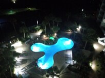 Night time view of pool from upper floor elevator hall