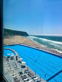 Sunny pool and ocean view.