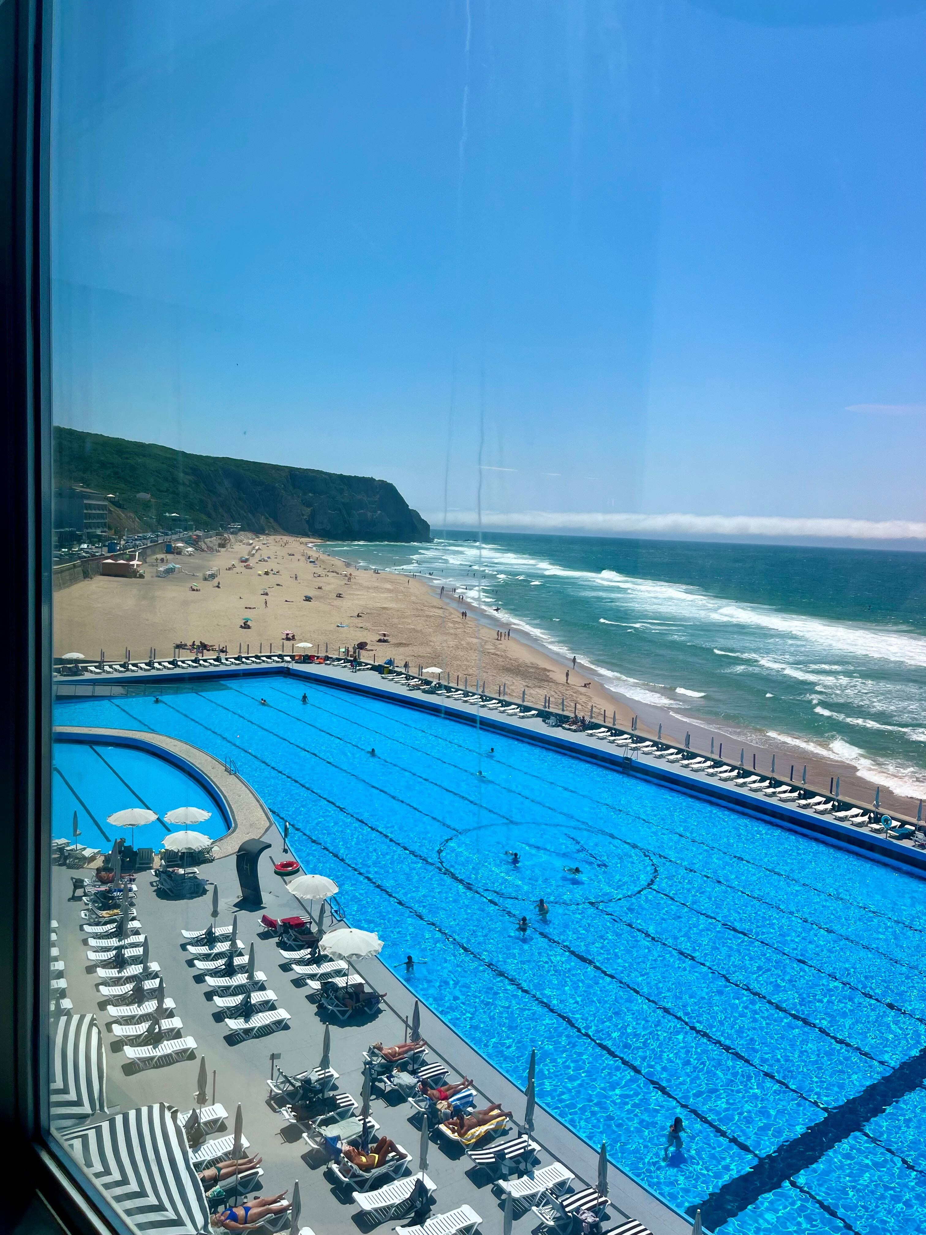 Sunny pool and ocean view.