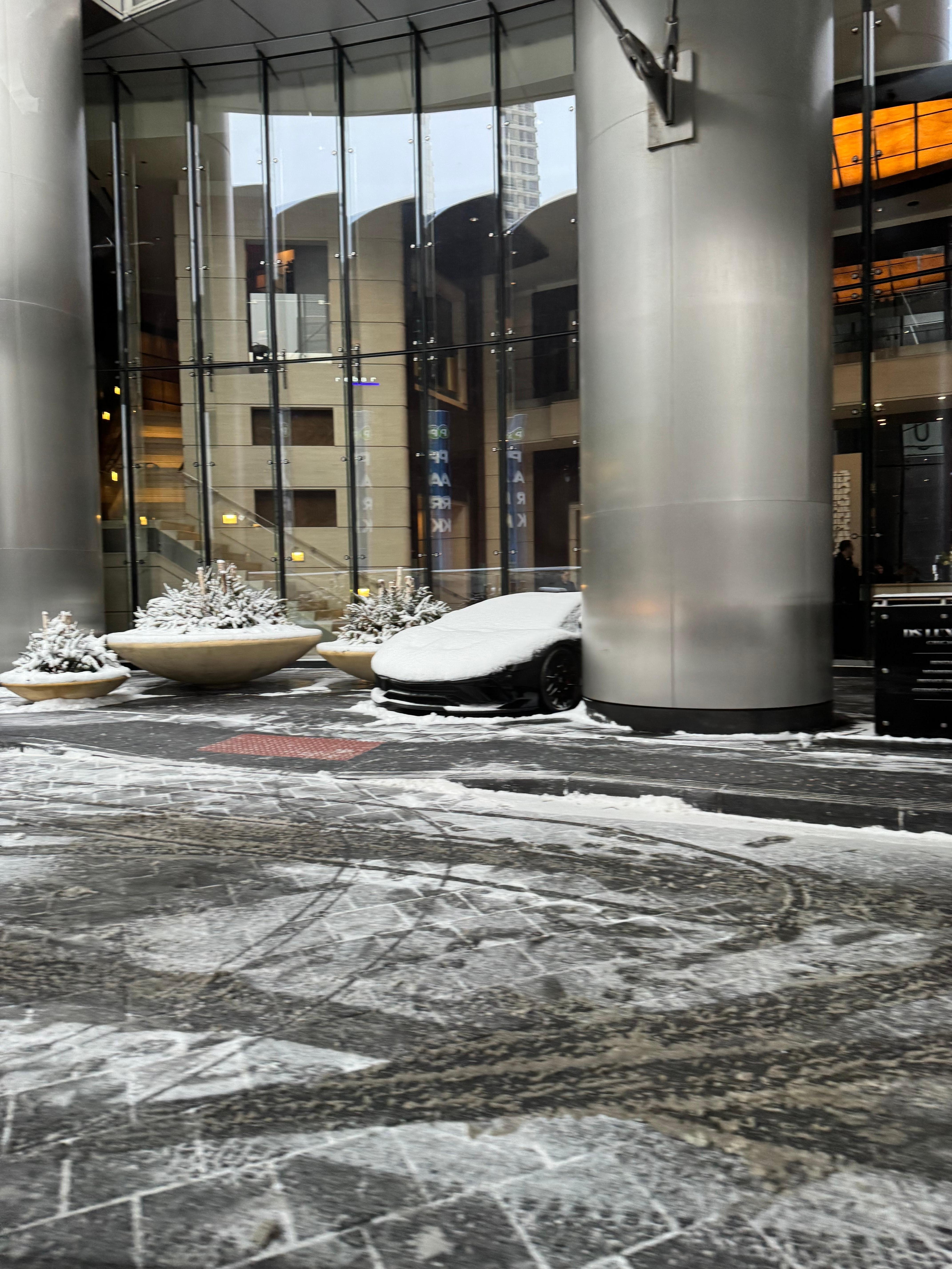 Outside the hotel, Lamborghini covered in snow