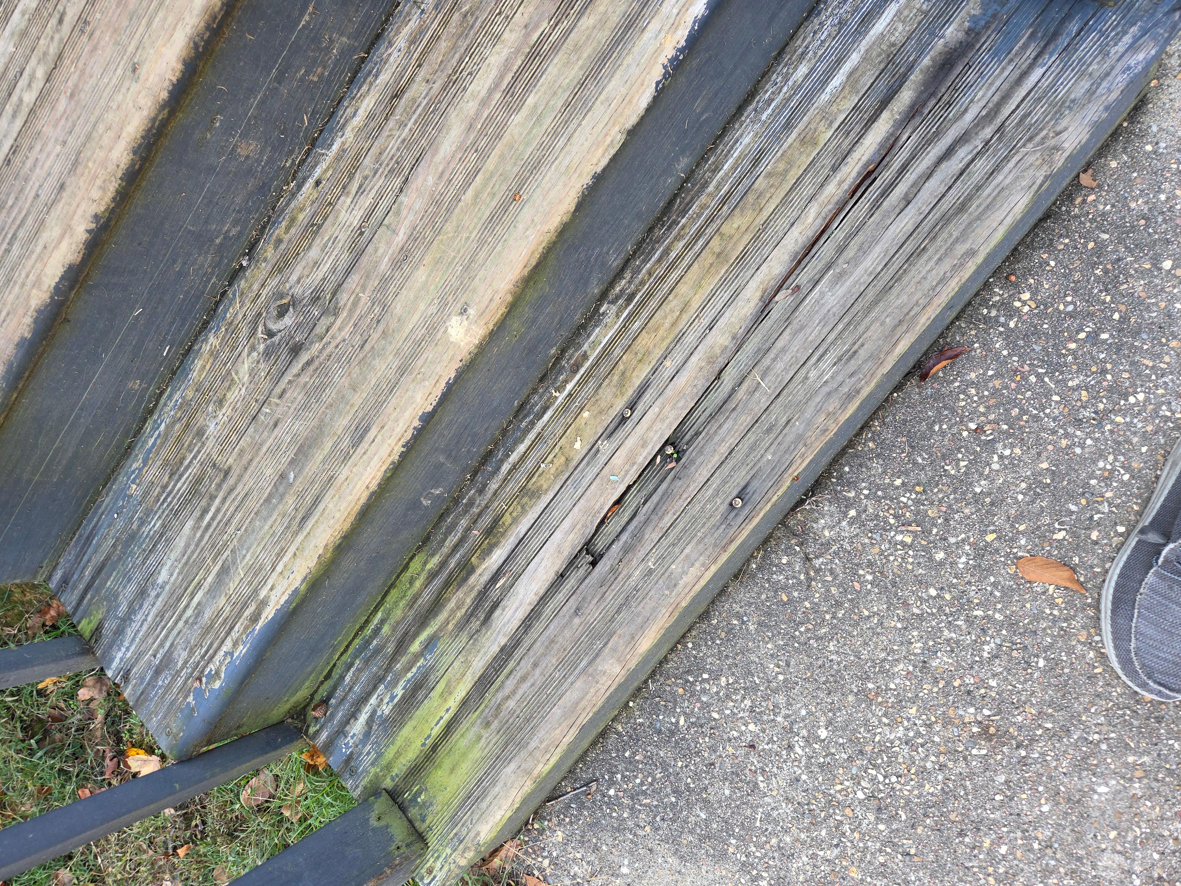 Rotted front steps with exposed screws