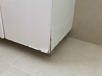 Water damaged sink cabinet, same in all bathrooms.