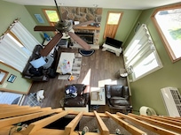 View of living room area from loft. Imagine your small child falling from here. I had to imagine it daily and could not relax any time we had child upstairs or if she went near stairs when on 1st floor. We brought folding baby gate but did not fit.