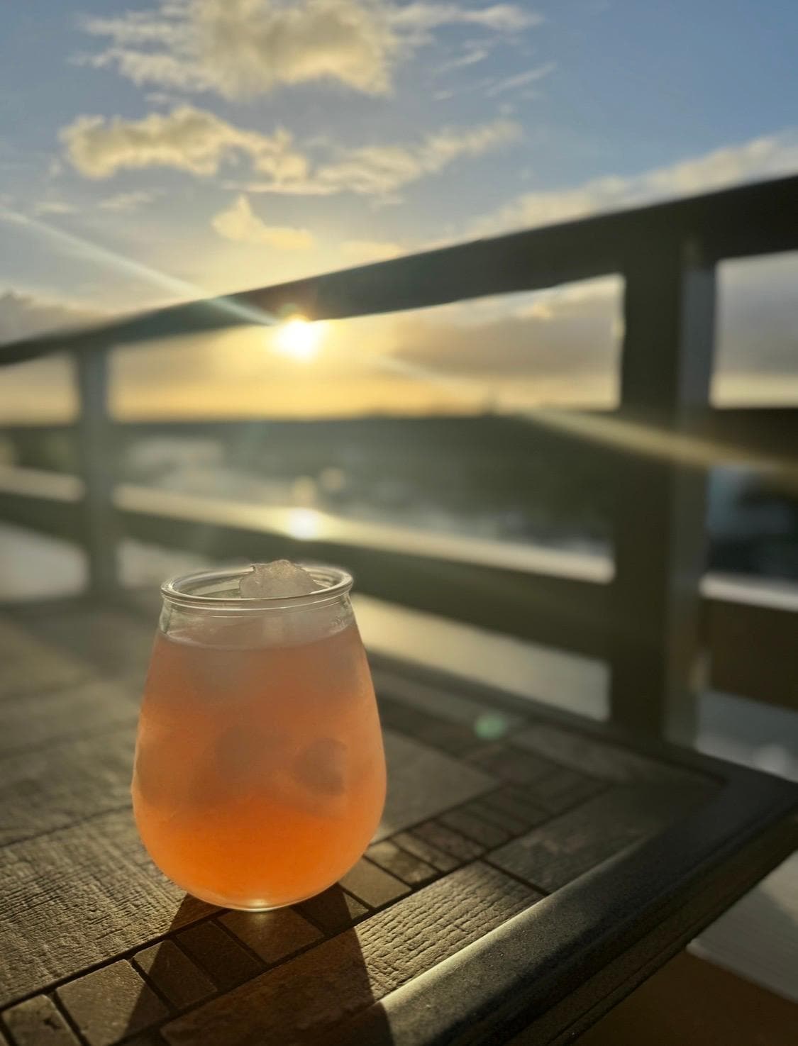 Evening cocktail at sunsetfrom the balcony. 