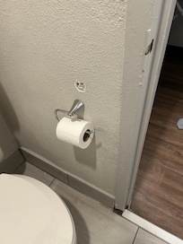 Holes from where the TP holder used to be, one of many snags which could easily be corrected.