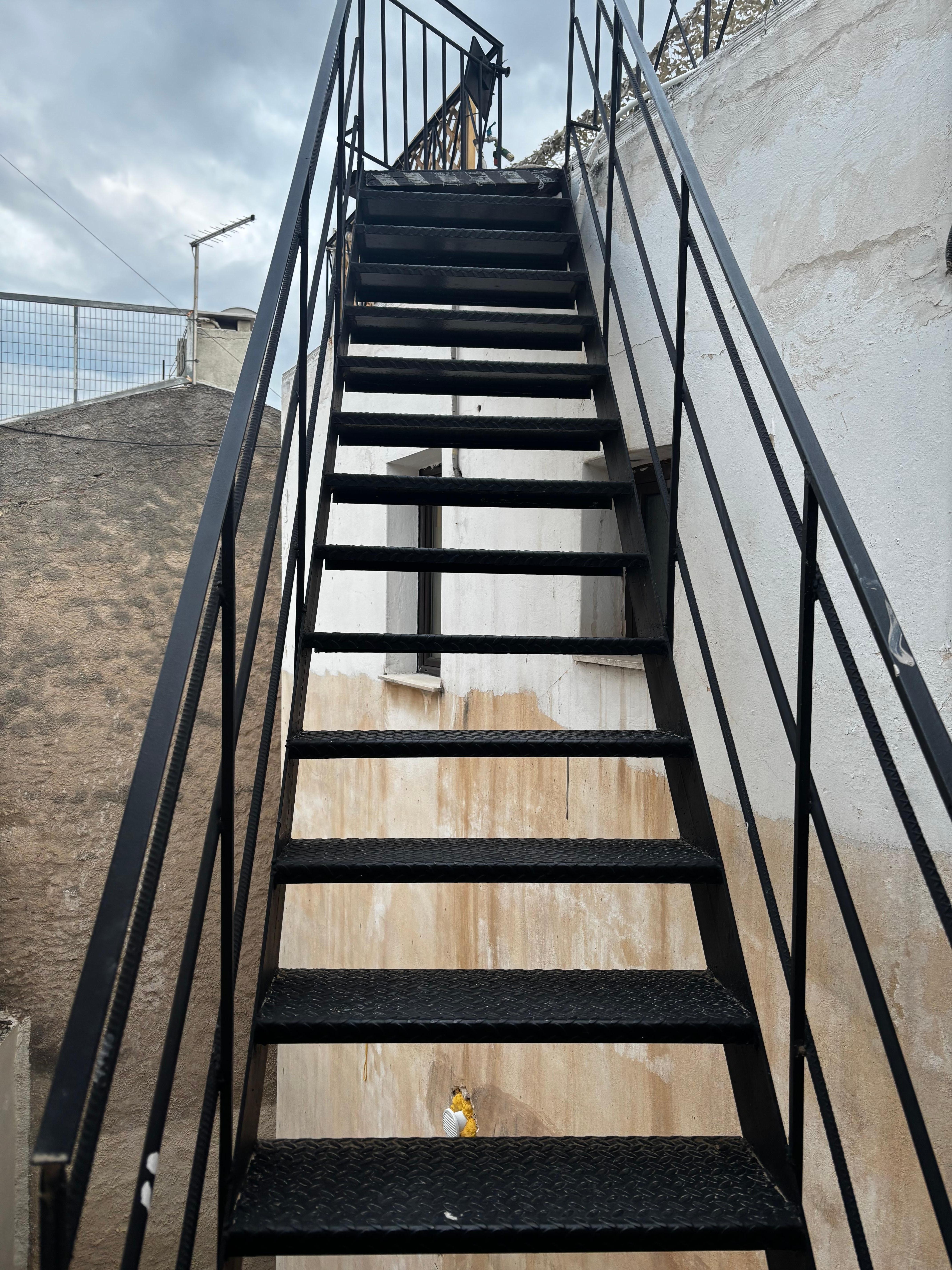 Stairs up to balcony 