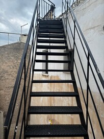 Stairs up to balcony