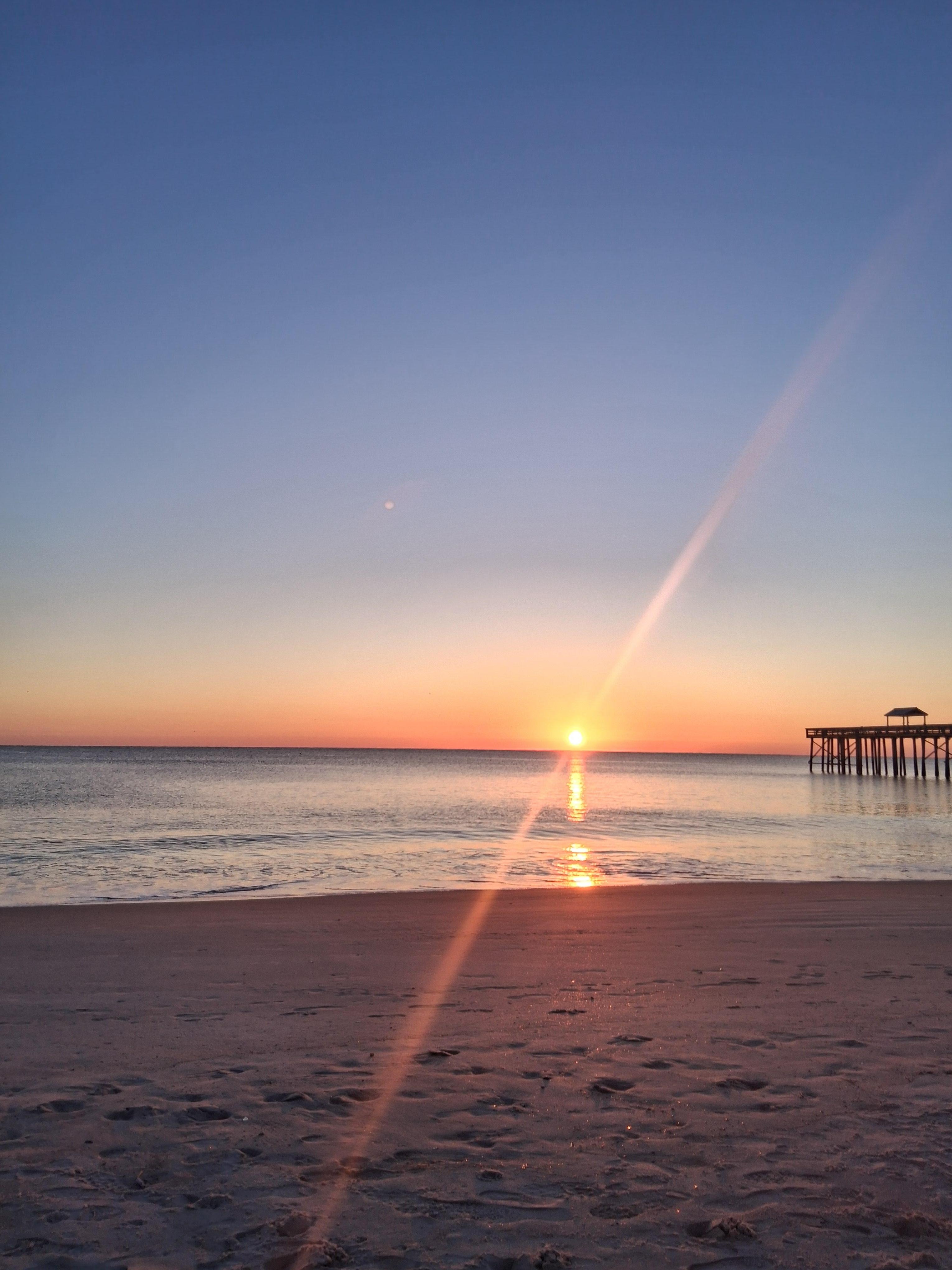 Sun rise from the beach behind the motel
