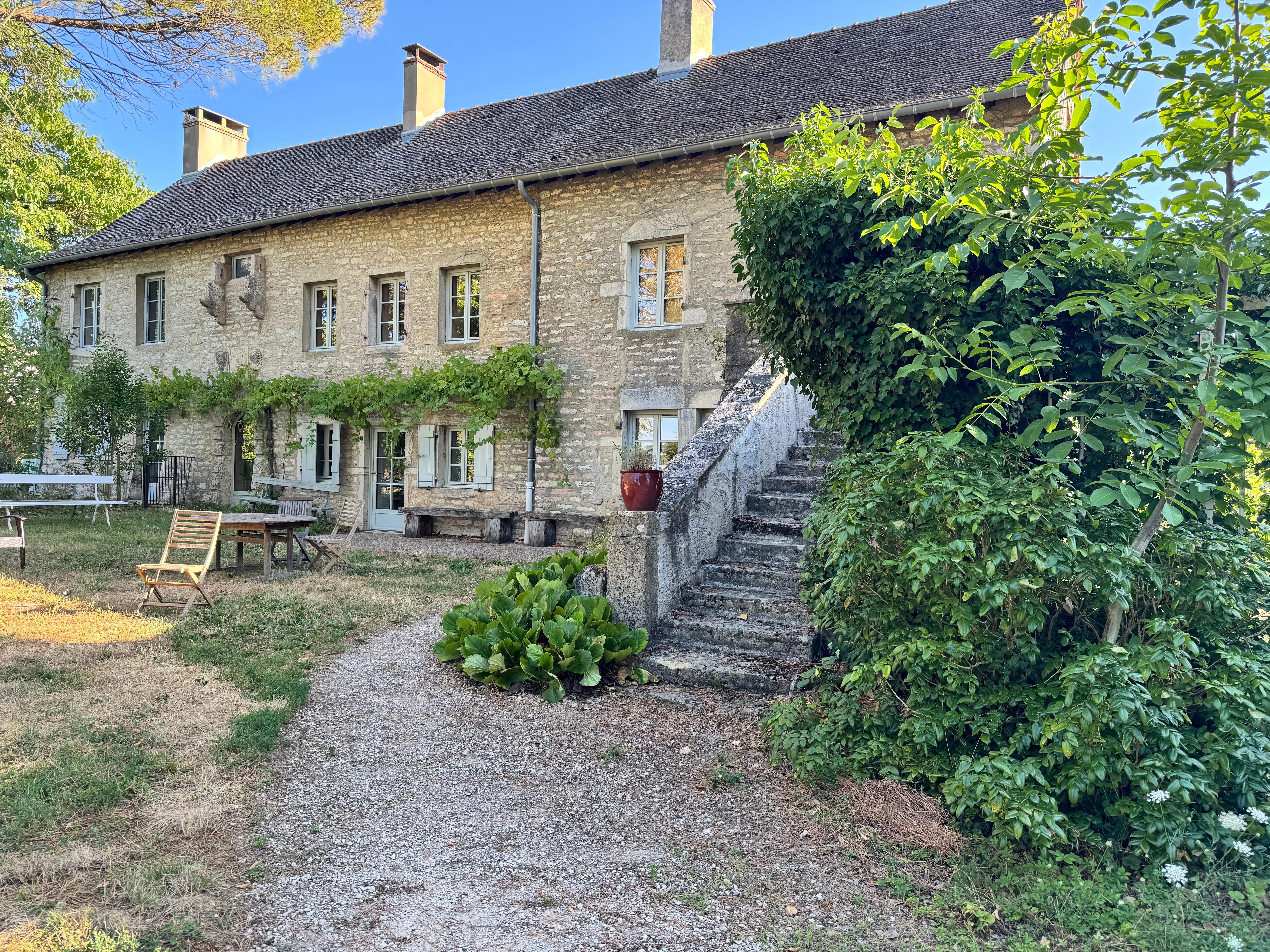 Front of the building with seating.