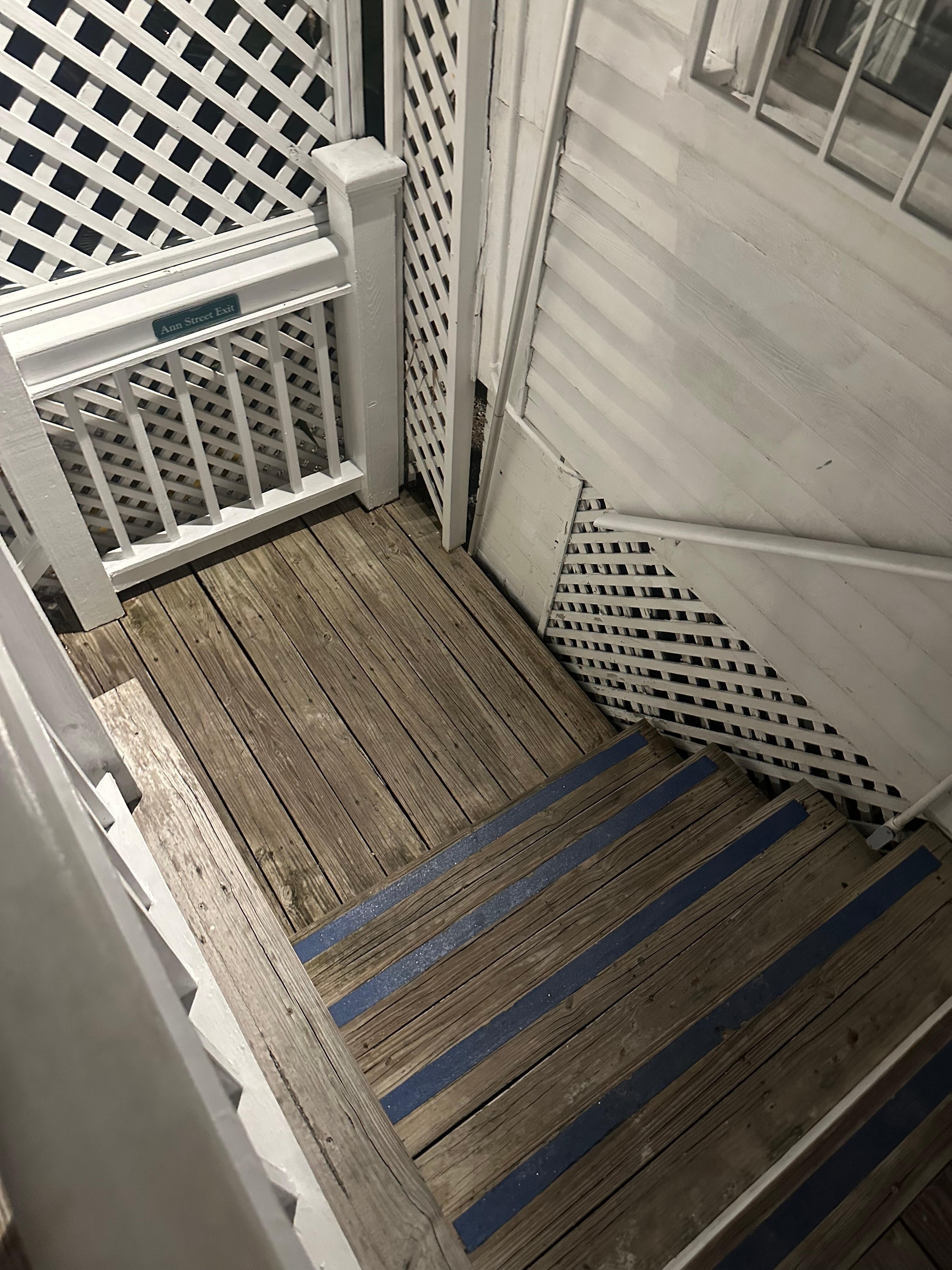 Another flight of stairs outside of 115