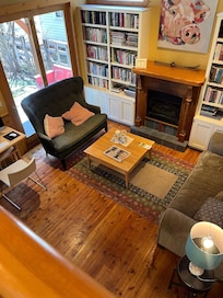 Indoor guest seating with extensive library.
