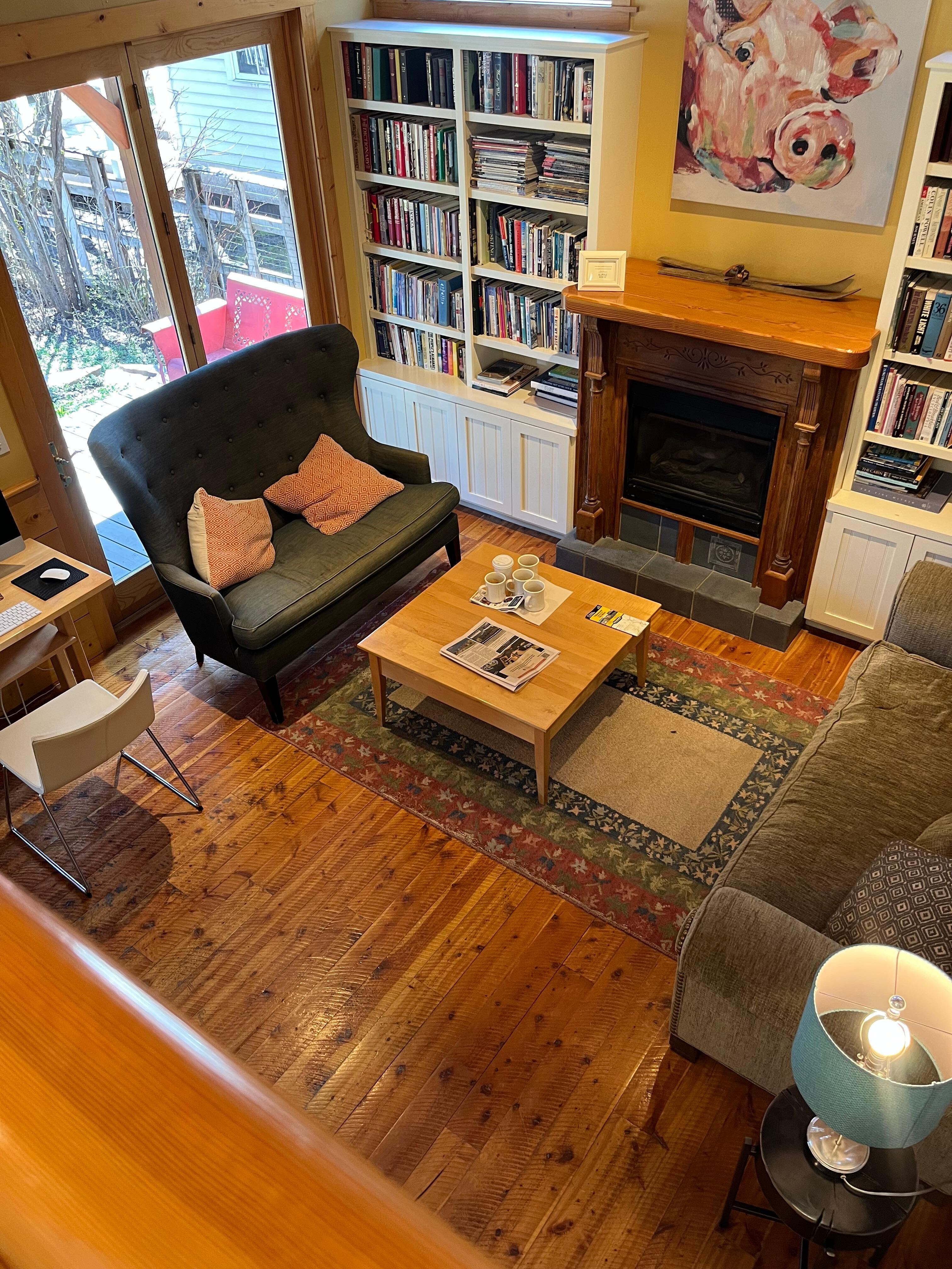 Indoor guest seating with extensive library. 